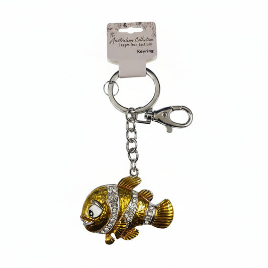 Gold clownfish-shaped keychain with a tag 